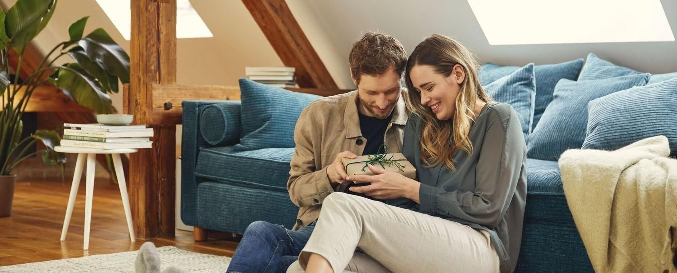 Couple holding gift package