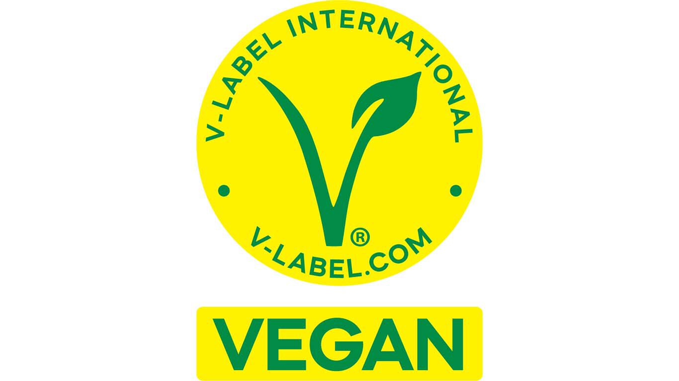 V‑Label G&uuml;tesiegel f&uuml;r vegane Produkte in Gelb mit gr&uuml;nem V‑Symbol.