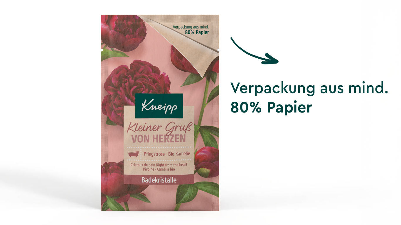 Produktabbildung der Kneipp Badekristalle Kleiner Gruß von Herzen. Pfeil mit Text daneben: Verpackung aus mind. 80% Papier.