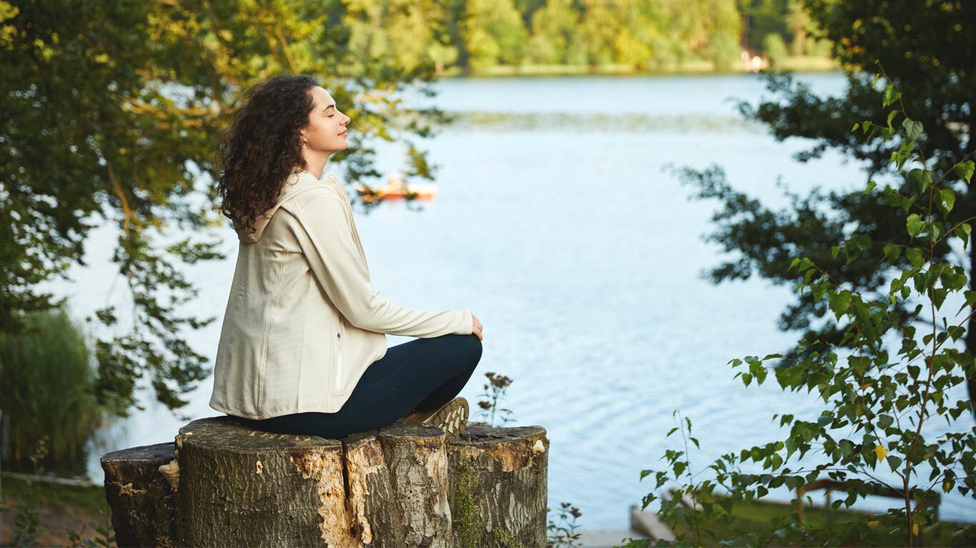 A woman relaxing in nature.